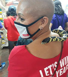 teacher with a snake on her shoulder