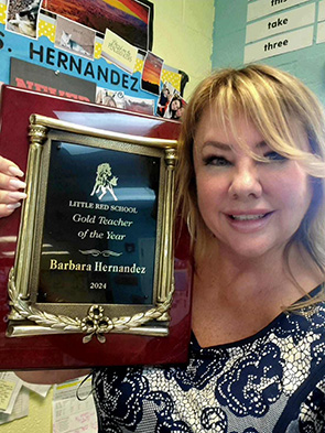 2023-2024 Teacher of the Year Ms. Barbara Hernandez with her award